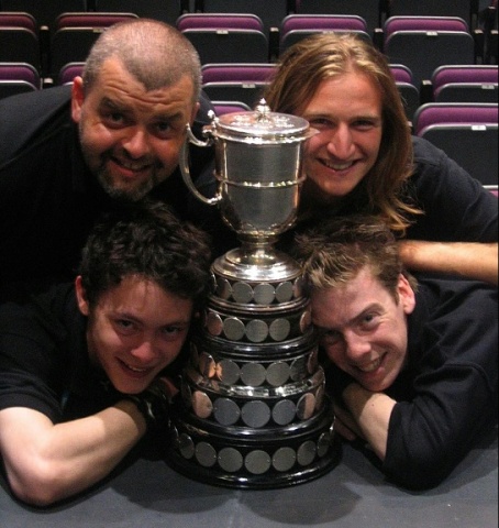 Select this image to see a larger version. Peter Sharman, Phil Macken, James Cooke and Mark Oldknow with the Howard de Walden Ewer Trophy from the British Festival Final